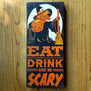 Halloween Sign Witch holding a Pumpkin Eat Drink and be Scary
